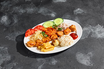 Chicken shashlik platter with vegetables, fries and rice, bright lighting, overhead composition