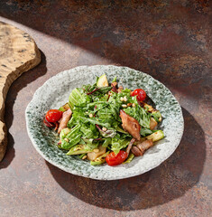 Duck salad with zucchini and tomatoes, bright natural lighting, overhead composition