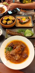 Thai Herb Sausage , Grilled crab fat, Grilled pork sausage wrapped in banana leaves ,Nam Ngiao Rice...