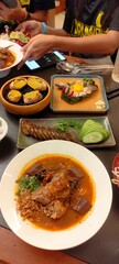 Thai Herb Sausage , Grilled crab fat, Grilled pork sausage wrapped in banana leaves ,Nam Ngiao Rice...