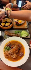 Thai Herb Sausage , Grilled crab fat, Grilled pork sausage wrapped in banana leaves ,Nam Ngiao Rice...