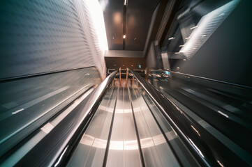 Moving escalator in urban setting, Tokyo, Japan