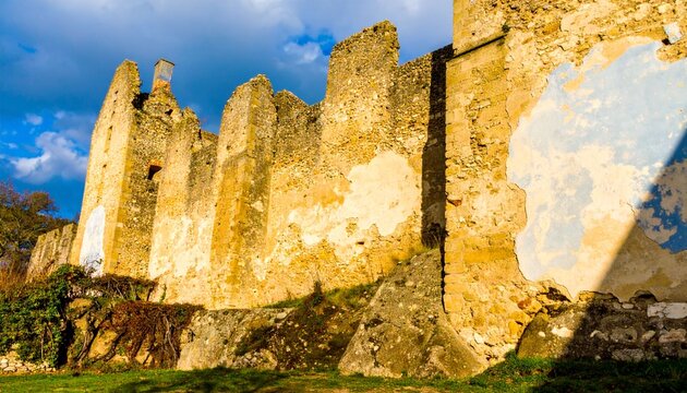 Dramatic Stone Wall of the Ruined Castle Under Beautiful Blue Sky