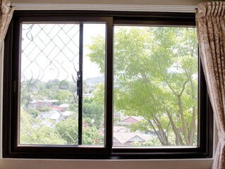 Naklejka premium Interior view of a window with a city and tree view