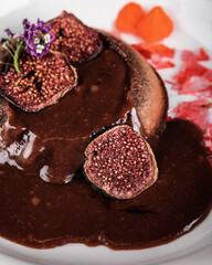 Indulgent Decadent Chocolate Dessert Accompanied by Fresh Figs and an