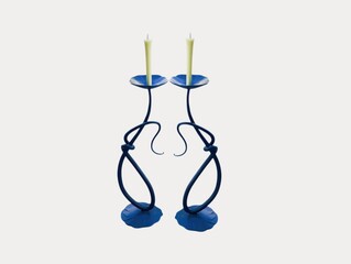 The white background in the picture is a black patterned candle holder with a base and a dark blue...