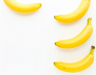 Fresh and Ripe Yellow Banana Food Group Arrangement on White Backdrop