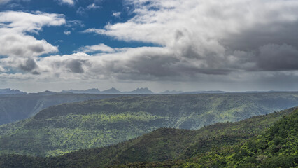 Beautiful mountain panorama. The slopes are covered with green vegetation. A plateau on a flat top....