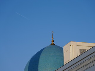 Modern Minor Mosque in Tashkent, Uzbekistan, with white marble and blue domes, photographed in...