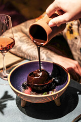 Indulge in a decadent chocolate dessert adorned with a rich