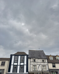 Historic European Half-Timbered Houses Under Cloudy Sky