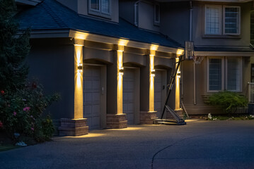 Garage door in luxury house with trees and nice landscape in Spring in Vancouver, Canada, North...