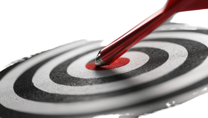 Red dart hitting bullseye of target