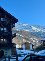 Traditional Alpine Chalets with Snow-Covered Mountains in the Background, Valais, Switzerland