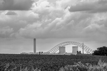 Black and white view of Runcorn Bridge with the cooling towers and chimney of Fiddler’s Ferry...