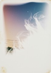 Dreamy coastal view with hazy cloudscape evoking serene atmosphere and tranquility