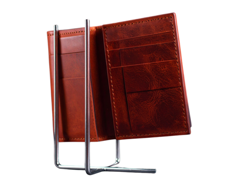Untitled design - Brown leather cash wallet on display stand under warm indoor lighting, PNG cutout