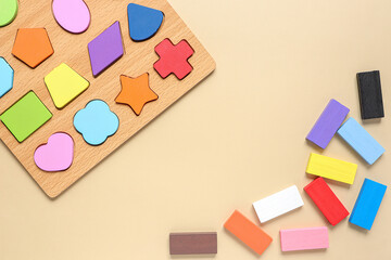 Wood Geometric Shapes with colorful wooden blocks. Set of different children's toys on beige...
