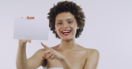 Pointing, beauty or happy woman with board for skincare, space or cosmetics on white background....