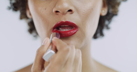 Red lipstick, apply and woman in studio for makeup, beauty products and cosmetics. Classy, female...