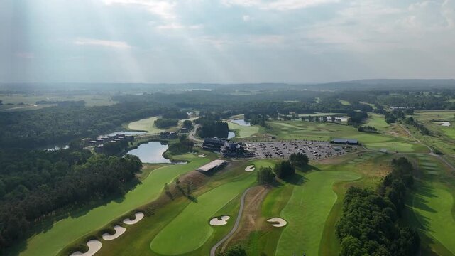 Drone flying above fairway at TPC Toronto golf course with trees and open sky