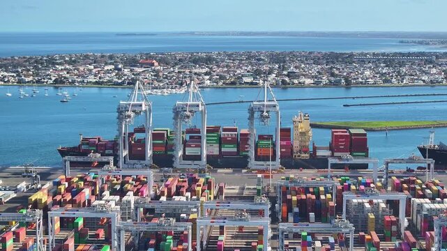 Aerial view of cranes loading container ships at Melbourne&rsquo;s Victoria International Container Terminal in Port Phillip Bay
