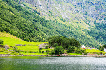 Scenic Fjord Landscape with a Traditional Wooden Boat in Norway