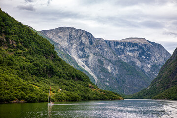 Sailboat Navigating the Majestic Fjord in Norway