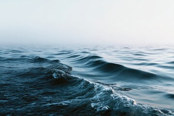 Calm, misty ocean waves