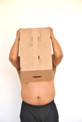 Anonymous Struggles: Overweight Man Hiding Behind a Cardboard Box