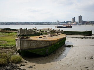WWII concrete barges abandoned on shore of Thames Estuary.