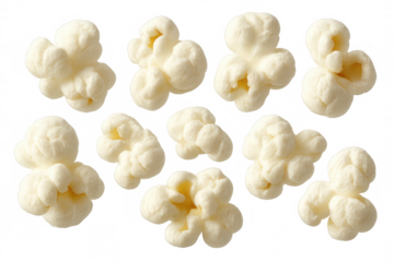 Popped popcorn kernels falling freely, white fluffy pieces suspended mid-air on transparent backdrop, cinema snack concept