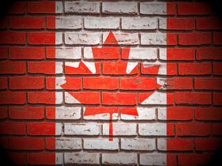 Old brick wall Canada flag