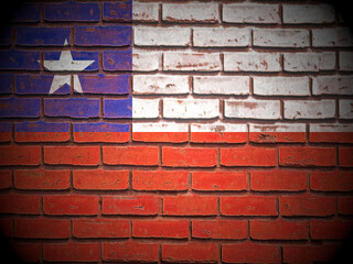 Old brick wall Chile flag