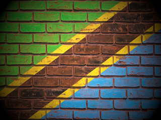 Old brick wall Tanzania flag
