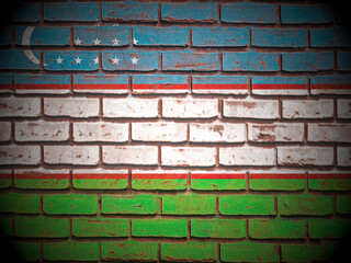Old brick wall Uzbekistan flag