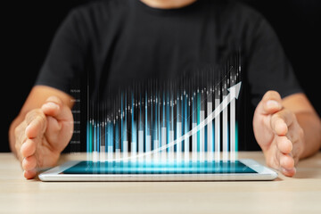 Businessman presenting upward trending financial growth graph on digital tablet; modern, clean, and...
