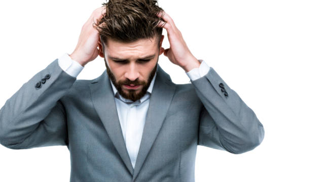 Man in formal jacket runs hands through disheveled hair looking down in despair, cut out transparent