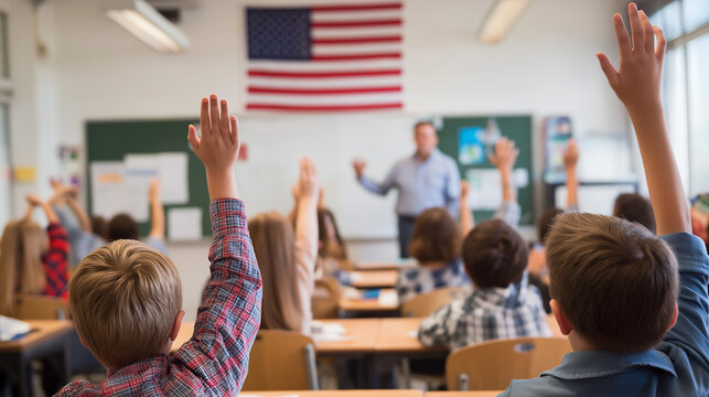 students raise hands during class in American school