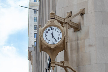 An old fashioned clock on wall of downtown Cincinnati, Ohio building.