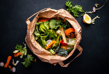 Zero waste concept. Food trash in recyclable paper bag for compost. Sustainable lifestyle, plastic...