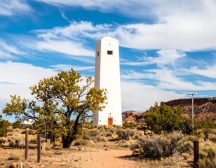 Obraz premium White tower in desert landscape (1)