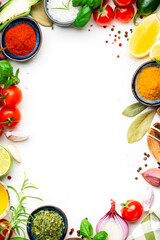 Healthy cooking food background with spices, herbs, turmeric, dried herbs, chili powder and kitchen utensils, white table, top view