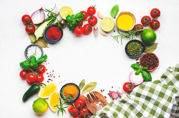 Healthy food cooking frame background with spices, herbs, turmeric, chili powder, towel and kitchen...