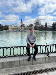 Tourist Gazing Over the Lake : A solitary figure gazes across the serene lake, an awe-inspiring...