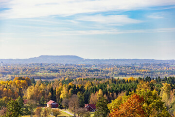 Beautiful autumn colors in a landscape view with a small farm