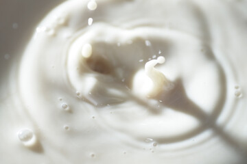 Close up shot of cow milk splash as background