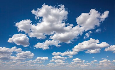 Fluffy white clouds scattered across a vibrant blue sky
