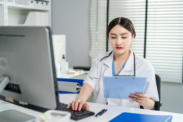 Asian female doctor use laptop give medical advice to a patient online. 