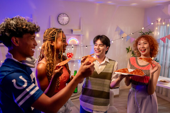 Group of diverse Generation Z friends enjoying a party in cozy house.